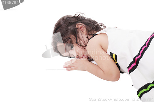 Image of small child holding a finger in his mouth. studio photos. Close-