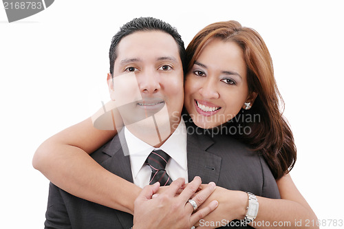 Image of Portrait of loving couple hugging man from behind