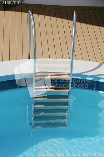 Image of Pool ladder and swimming pool 