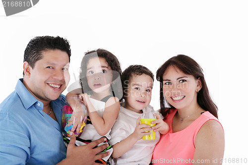 Image of Portrait of young couple having fun with their daughter and son.