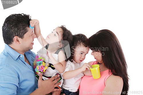 Image of portrait of a nice family playing on white 