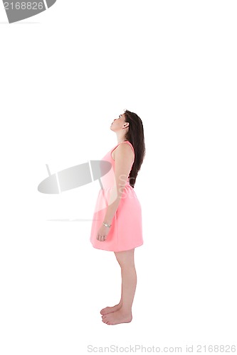 Image of Portrait of a thinking woman full-length looking away on copyspa