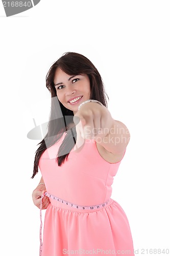 Image of weight loss woman smiling happy excited standing with measuring 