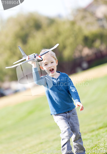 Image of child playing with a plane