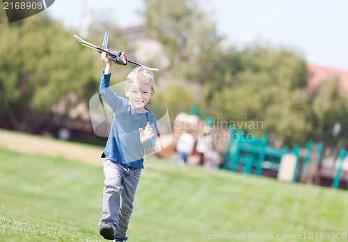 Image of child playing with a plane