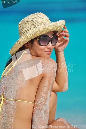 Image of beautiful  woman relax on tropical  beach