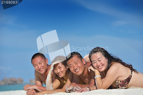 Image of group of happy young people have fun on bach