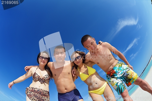 Image of group of happy young people have fun on bach