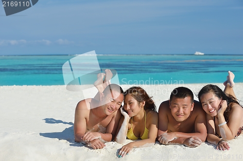 Image of group of happy young people have fun on bach
