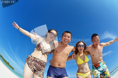 Image of group of happy young people have fun on bach