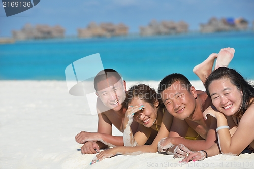 Image of group of happy young people have fun on bach