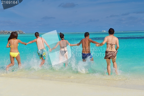 Image of group of happy young people have fun on bach