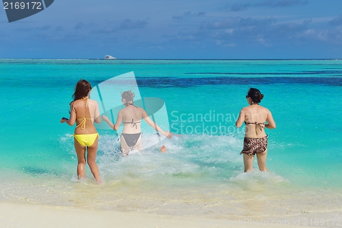 Image of group of happy young people have fun on bach