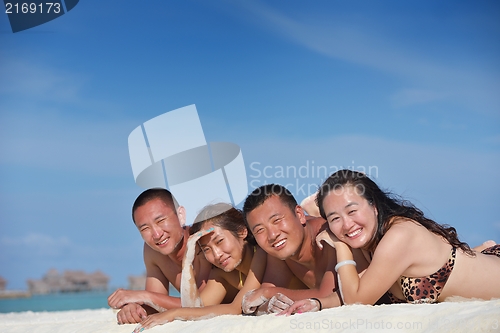Image of group of happy young people have fun on bach