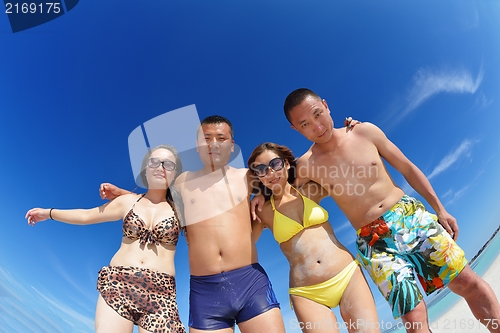 Image of group of happy young people have fun on bach
