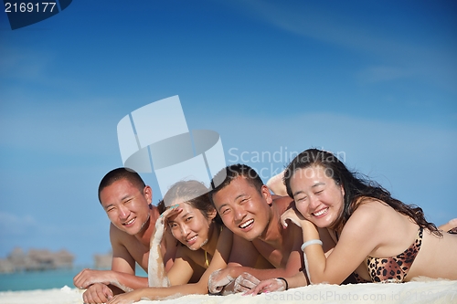 Image of group of happy young people have fun on bach
