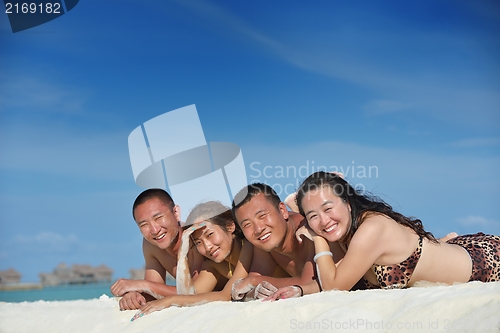 Image of group of happy young people have fun on bach