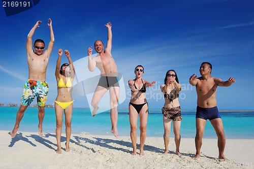 Image of group of happy young people have fun on bach