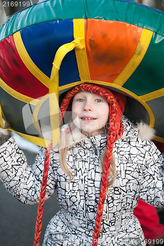 Image of portrait of little girl with sleigh on her head