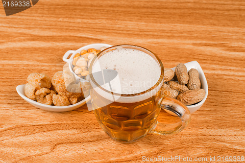 Image of Tankard of beer and snacks