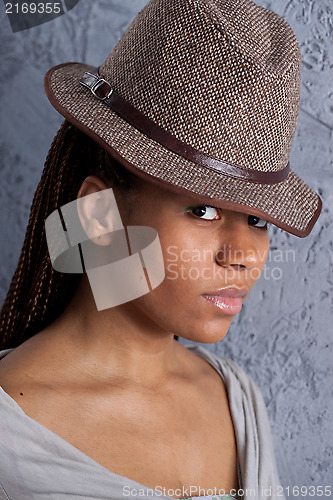 Image of young woman in hat