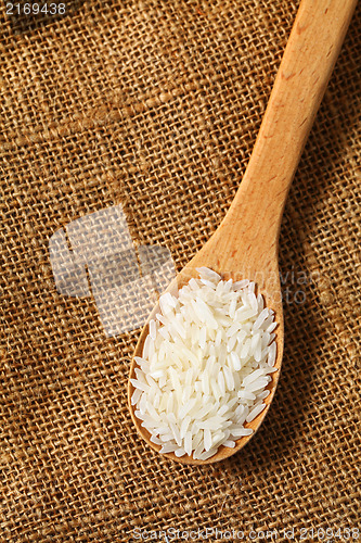 Image of Rice with wooden spoon 
