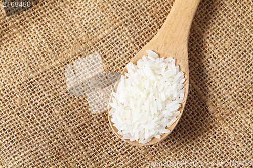Image of Rice with wooden spoon