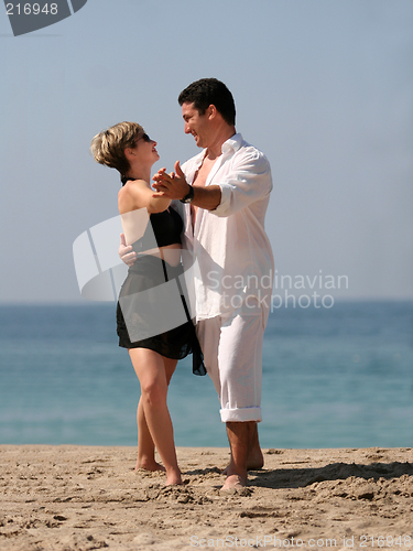 Image of Couple dancing on the beach