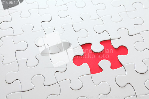 Image of puzzle with missing red piece