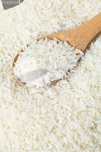 Image of Rice with wooden spoon