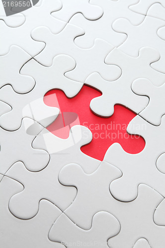 Image of puzzle with missing red piece