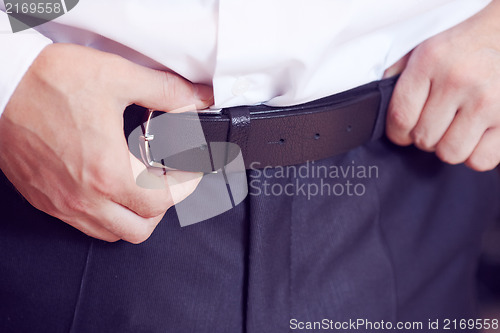 Image of Doing up belt