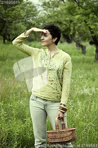 Image of woman with basket in the garden