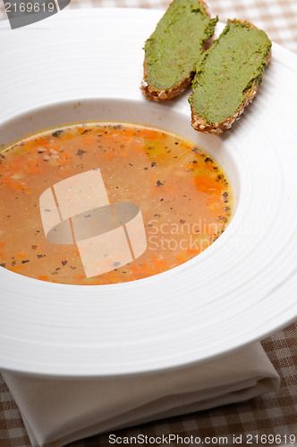 Image of Italian minestrone soup with pesto crostini on side