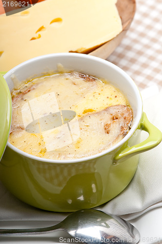 Image of onion soup with melted cheese and bread on top