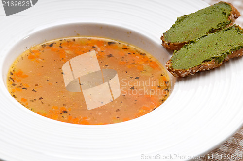 Image of Italian minestrone soup with pesto crostini on side