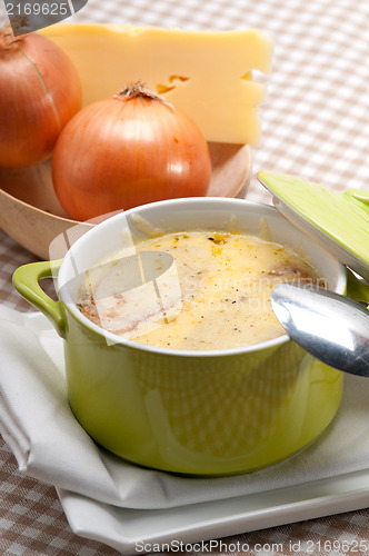 Image of onion soup with melted cheese and bread on top