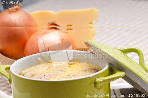 Image of onion soup with melted cheese and bread on top