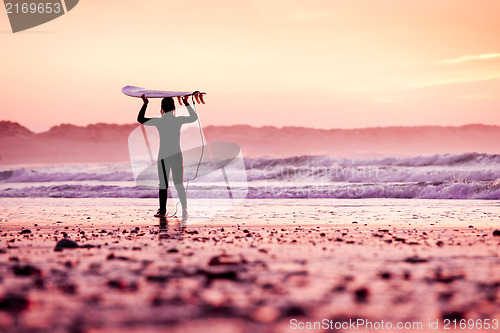 Image of Female surfer