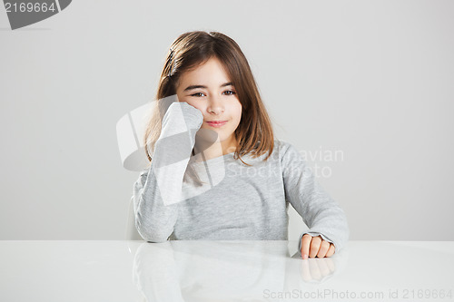 Image of Little girl in a desk