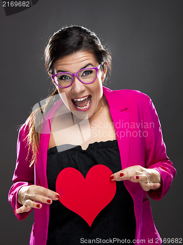 Image of Funny woman holding a heart