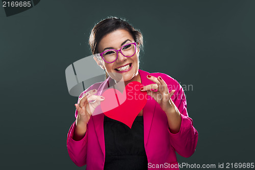 Image of Funny woman holding a heart