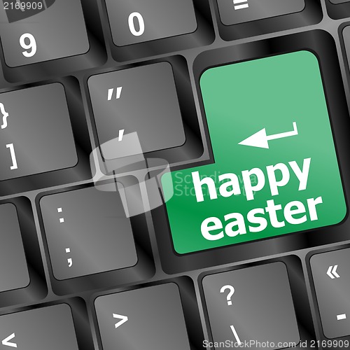 Image of happy Easter text button on keyboard with soft focus