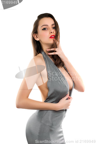 Image of Pretty brunette in grey dress