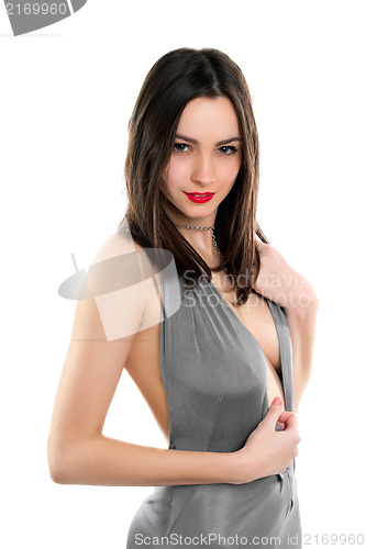 Image of Brunette posing in grey dress