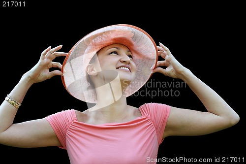 Image of Woman in a pink straw hat