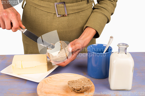 Image of Buttering bread