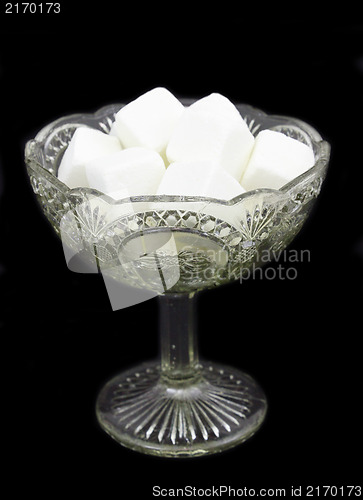 Image of White sugar in a glass vase