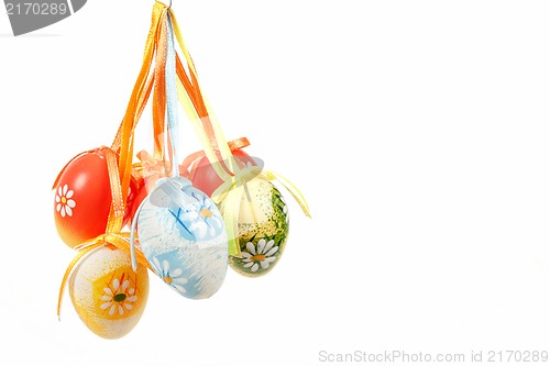 Image of hanged bright color easter eggs with bows