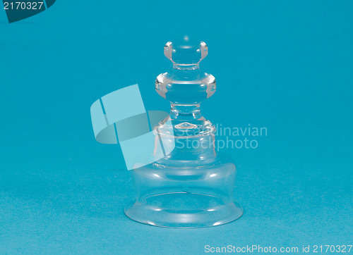 Image of beautiful curvy glass decoration blue background 